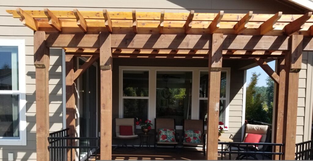 Cedar pergola over a deck seating area