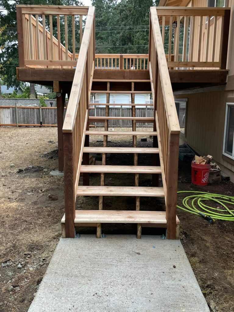 Cedar stairs and landing leading to an elevated deck