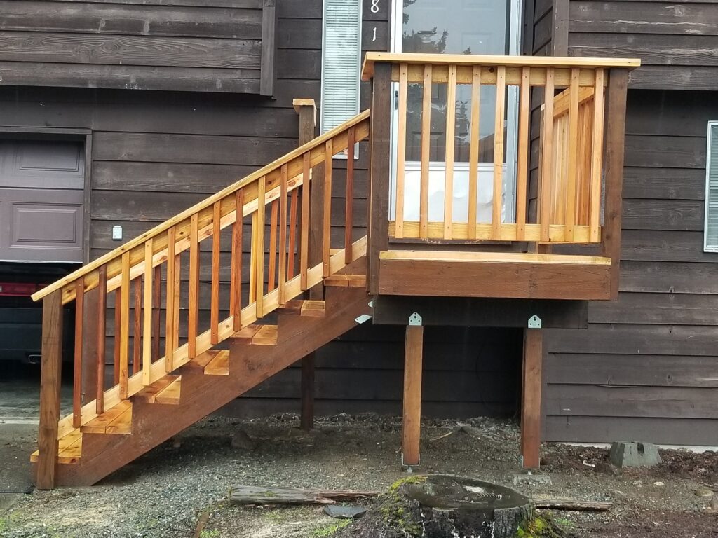 Cedar deck stairs and landing with wood railing