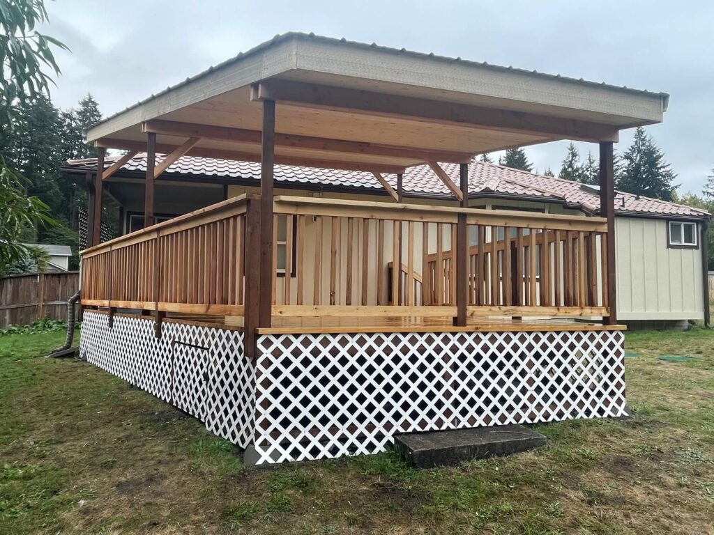 Covered wood deck with railing and lattice skirting