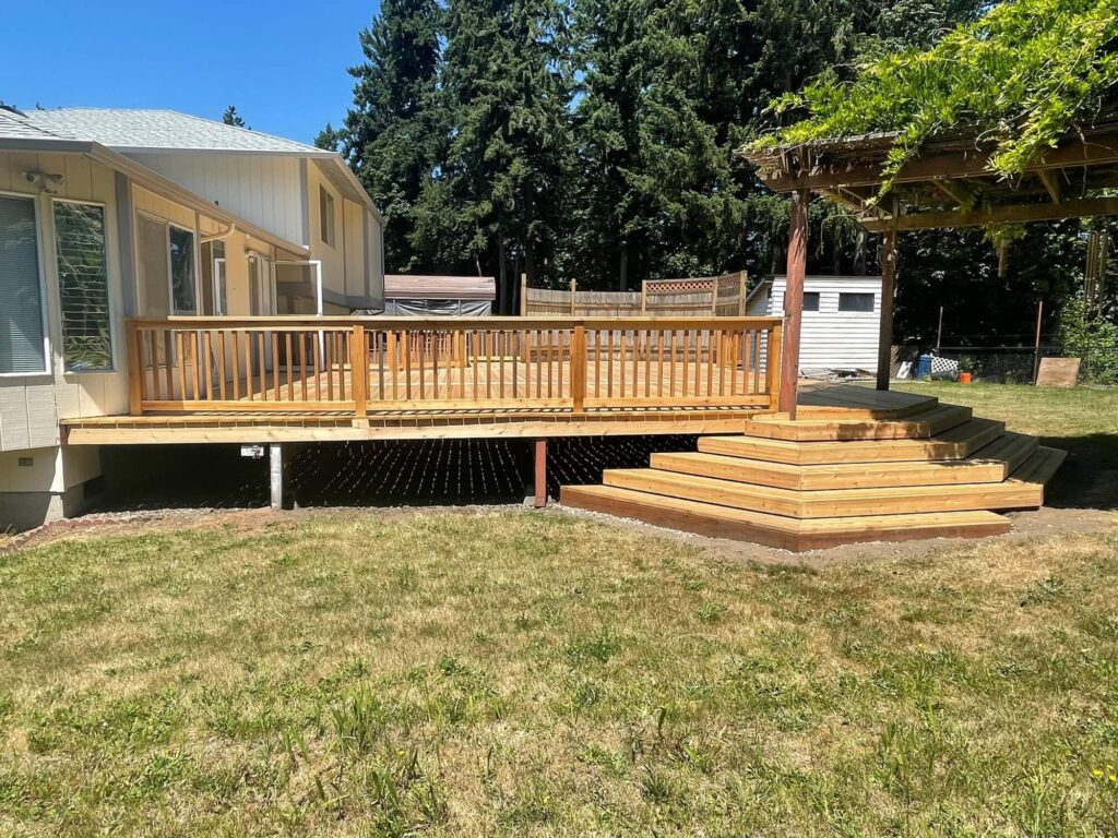 Cedar deck with wraparound stairs and wood railing