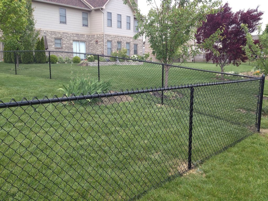Black chain link fence around a residential backyard in Pierce County, WA